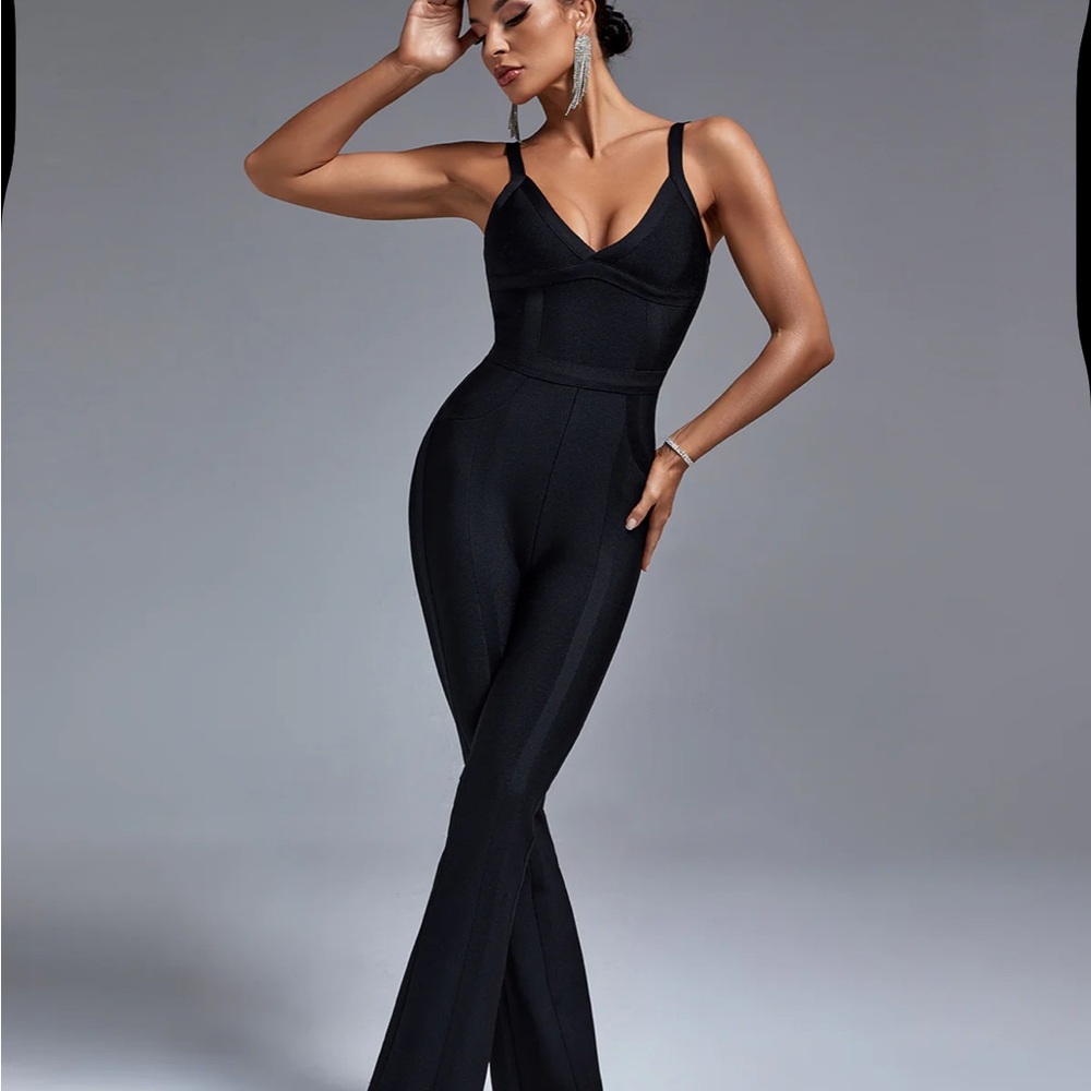 Black full-length jumpsuit with plunging V-neckline and figure-hugging fit